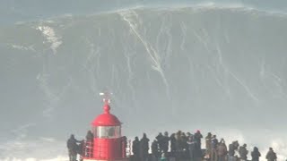 Big wave surfers ride 20 metre waves in Nazare [upl. by Naryk]