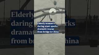 Elderly woman climbs to top of bridge in China eventually rescued [upl. by Atived]