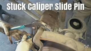 Here Is How To Remove A Stuck Caliper Slide Pin [upl. by Alakcim]