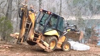 Cat 420E Backhoe Moving a 7000 Pound Limestone Block [upl. by Aihsekel]