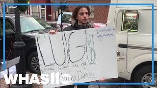 Spectators hold signs of support outside Luigi Mangione court appearance [upl. by Ayotas]