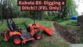 Kubota BX Digging a ditch with the front end loader [upl. by Hardej]