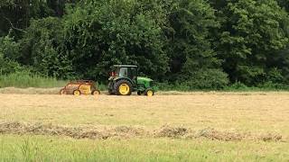 John Deere 5065M raking Soybean and Millet Hay 2017 [upl. by Zetra]