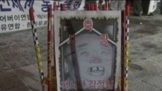 AntiNorth Korea activists celebrate Kim Jongils funeral [upl. by Roth]