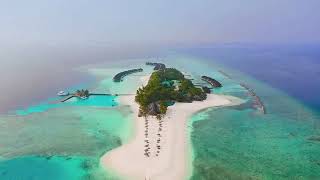 4k Drone Footage of the Secluded Veligandu Island Resort  Maldives  Crown amp Champa Resorts [upl. by Alusru]