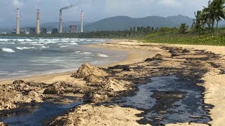 Fishermen clean up oil spill on Venezuela beach  AFP [upl. by Carmel124]