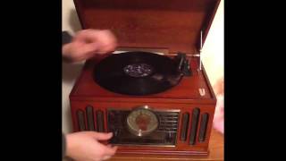 How to Use a Record Player [upl. by Suehtomit]