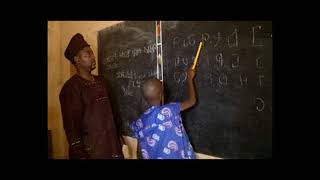 Teaching ODUDUWA ALPHABET in the Classroom at PortoNovo City [upl. by Nylakcaj]