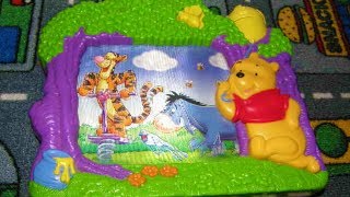 FisherPrice Winnie The Pooh Scrolling Musical wind up TV toy [upl. by Sremlahc38]