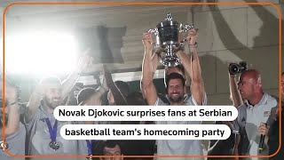 Novak Djokovic celebrates with Serbian basketball team [upl. by Silliw]