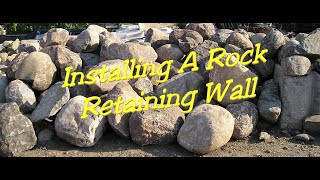 Installing a rock retaining wall [upl. by Pippy]