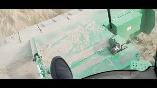 Running a John Deere W260R with 16 foot disc header cutting lovegrass [upl. by Nahtam]