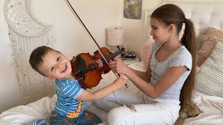 My 2 yearold brother wants to play a full size violin I am teaching him [upl. by Agnimod]