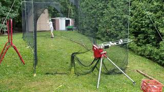 Batting Cage Clip with Heater Pitching Machine [upl. by Nodgnal]