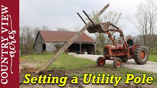 Setting a Utility Pole with a Tractor [upl. by Ahseined660]