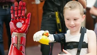 Robert Downey Jr Gives RealLife Iron Man Arm to Kid [upl. by Euqina]