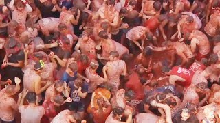 Food Fight 20000 People Toss Tomatoes at Spains La Tomatina [upl. by Mccallum]