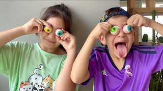 Trying Trolli Popeye taste test eyeball Gummy Trolli Glotzer eye popping candy with Ragdoll cat Leo [upl. by Atsev]