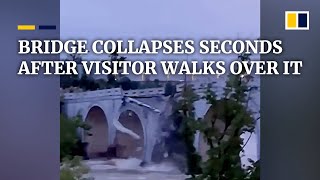 Bridge in China collapses seconds after visitor walks over it [upl. by Aikkin369]