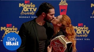 Sealed with a kiss WWE champions Becky Lynch and Seth Rollins [upl. by Kirtley]