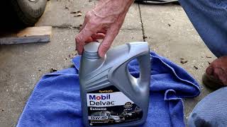 How to open an oil jug and new Mobil Delvac Synthetic [upl. by Enimisaj]