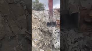 Excavator crushing shale rock process [upl. by Neelak437]