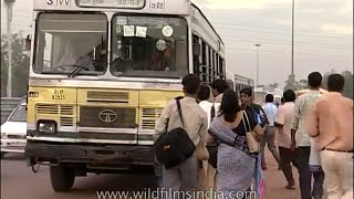 Delhi DTC diesel bus service circa 19982004  commuters board moving Blueline and Redline buses [upl. by Karlyn]