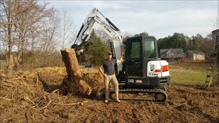 4000 lb stump Bobcat E42 excavator lifting HUGE stump [upl. by Kalam]