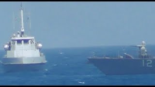 Watch as the US Navy fires warning shots toward an Iranian patrol boat [upl. by Ashwell]