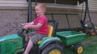 2YearOld Drives Himself To Fair On Toy Tractor [upl. by Zerimar]