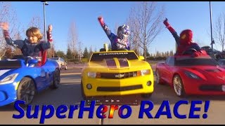 Superheroes Mega Power Wheels Race 3 5 Ride On Cars  Gabe and Garrett [upl. by Parthinia]