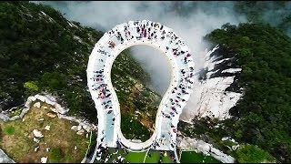 Terrifying glass skywalk in China offers breathtaking special effects [upl. by Yemac171]