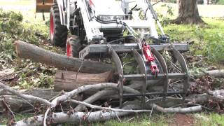 How To Use a Root Grapple On A Compact Utility Tractor [upl. by Tnahsarp]