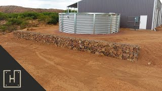 INEXPENSIVE AMAZING DIY GABION RETAINING WALL [upl. by Kehsihba]