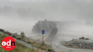 Bridge washed away by raging floodwater in New Zealand [upl. by Ordisy]