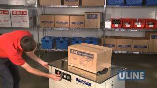 Uline H2079 SemiAutomatic Poly Strapping Machine  Demonstration [upl. by Bertold]