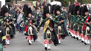 Huntly and District Pipe Band marching to the 2022 Braemar Gathering in Royal Deeside Scotland [upl. by Ylrebmic]