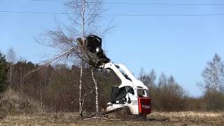 Bobcat T320 with Forestry Cutter and Bradco [upl. by Auhs]