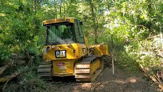 D4 Cat Dozer Cutting a driveway into the property Day one Part 1 [upl. by Akemit]