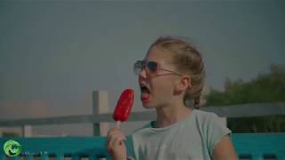 Happy child eating delicious fruit popsicle outdoors [upl. by Eibbor]