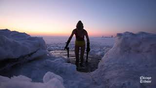 ‘Swimming through’ the winter in icy Lake Michigan [upl. by Ellennad553]