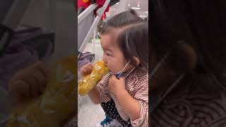 Cute toddler tries to eat bread while wearing face mask shorts [upl. by Cost11]