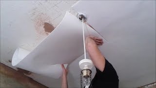 Applying Insulating Lining Paper To Ceiling [upl. by Ailimaj]