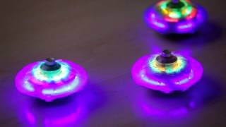 Light Up Spaceship Spinning Tops  HearthSong Toys [upl. by Xel940]